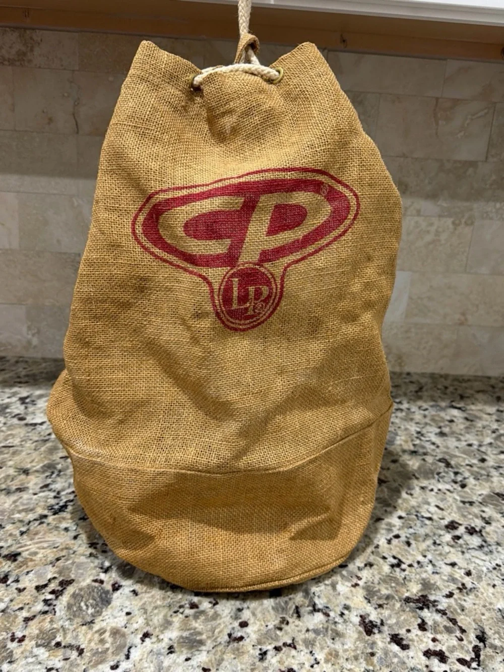 Tan Jute Drawstring Duffel Bag with Red Accent